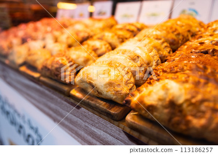 freshly baked empanadas with different fillings for sale freshly baked empanadas with different fillings for sale 113186257