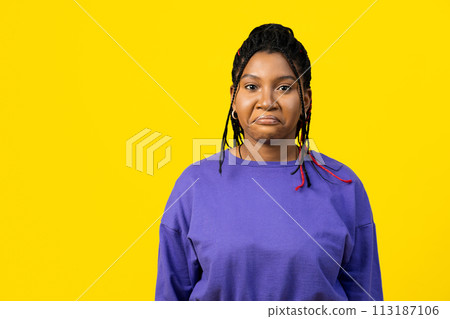 Sad Young Woman Against Bright Yellow Background 113187106