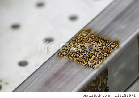 Close up scene the laser masking QR code on square tube. 113188671