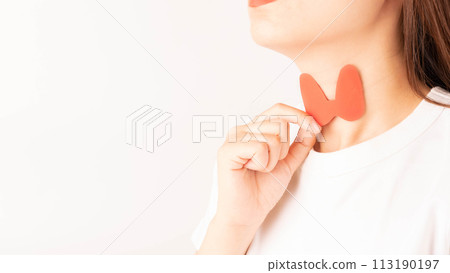 Female holding thyroid gland shape made from paper over her neck. Awareness of thyroid disorder includes goiter, hyperthyroid, hypothyroid, tumor or cancer. World Thyroid Day concept. 113190197