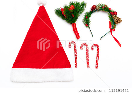 Red Santa's hat isolated. New Year's lollipops 113191421