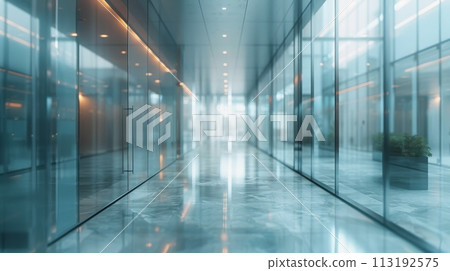 Long Hallway With Glass Walls and Potted Plant 113192575