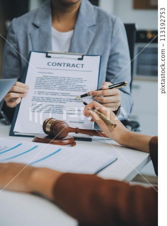 Businessman and lawyer discuss the contract document. Treaty of the law. Sign a contract business. 113192753