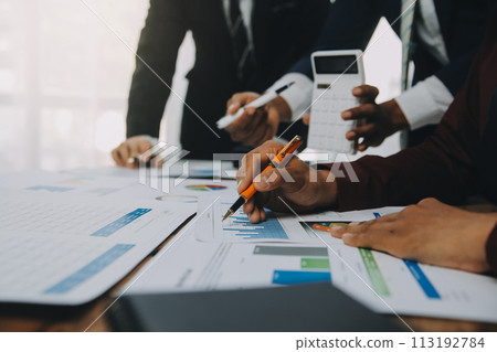 Business team working with new startup project plan and discussion information for financial strategy with laptop and digital tablet in a modern business lounge. 113192784