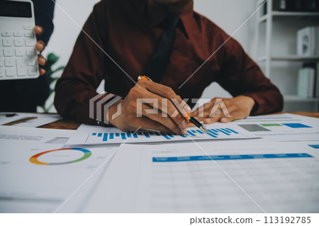 Business team working with new startup project plan and discussion information for financial strategy with laptop and digital tablet in a modern business lounge. 113192785