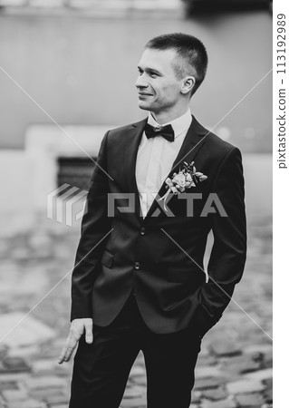 Headshot portrait of young man smiling isolated on outside outdoors background 113192989