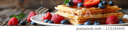 Indulge in the sweet harmony of waffles layered with ripe berries and drizzled with syrup, cafe menu 113193445