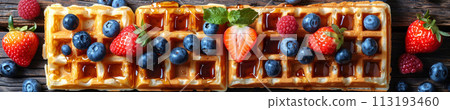 Indulge in the sweet harmony of waffles layered with ripe berries and drizzled with syrup, cafe menu 113193460