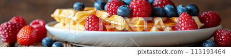 Indulge in the sweet harmony of waffles layered with ripe berries and drizzled with syrup, cafe menu 113193464