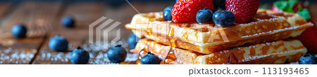 Indulge in the sweet harmony of waffles layered with ripe berries and drizzled with syrup, cafe menu 113193465