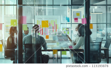 Group of People Standing Around Table 113193878