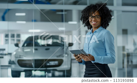 Woman Holding Tablet in Front of Car Woman Holding Tablet in Front of Car 113193898