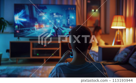 Boy Playing Video Game in Chair Boy Playing Video Game in Chair 113193944