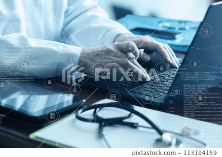 The doctor works with the help of modern technology and a computer. The doctor works with the help of modern technology and a computer. 113194159