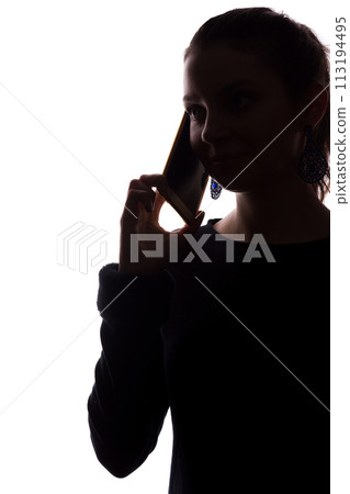 Young woman phone call - looks straight ahead, portrait isolate silhouette 113194495
