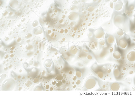 Close up of soapy foam texture as a background. Macro shot of bubbles with shimmering effect on the surface 113194691