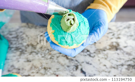 Using buttercream frosting, vanilla and chocolate cupcakes are intricately decorated to resemble various types of cactuses, creating a delightful and visually engaging dessert that showcases Using buttercream frosting, vanilla and chocolate cupcakes are intricately decorated to resemble various types of cactuses, creating a delightful and visually engaging dessert that showcases 113194750