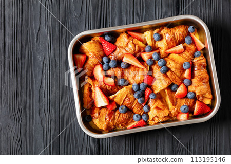 berry croissant casserole in baking dish, top view 113195146