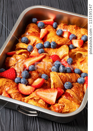 berry croissant casserole in baking dish, top view 113195147