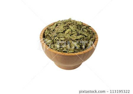 Dried leaves o Lemon verbena in latin Aloysia citrodora in wooden bowl isolated on white background. Medicinal herb. 113195322