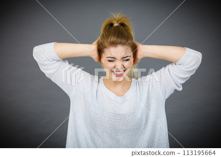 Unhappy woman screaming and yelling in pain Unhappy woman screaming and yelling in pain 113195664