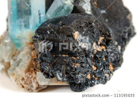 Macro mineral stone Aquamarine and black tourmaline, Schorl on a white background 113195835
