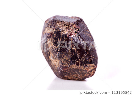 Macro of a mineral garnet stone on a white background Macro of a mineral garnet stone on a white background 113195842