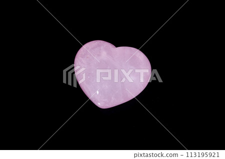 Macro mineral stone Heart pink quartz on a black background Macro mineral stone Heart pink quartz on a black background 113195921