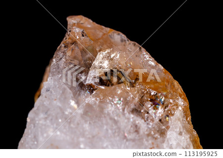 Macro mineral stone Citrine on black background 113195925