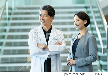 A businessman talking to a doctor A businessman in a business meeting 113196335