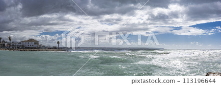 Churning Turquoise Waters of Portixol against a Dramatic Cloudy Sky, Palma de Mallorca 113196644