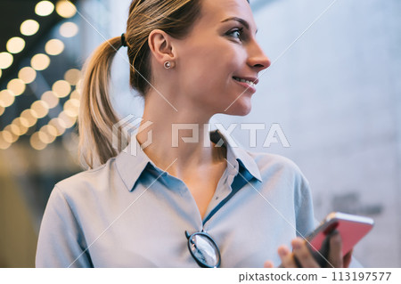 happy smiling caucasian hipster girl using modern technology outdoors 113197577