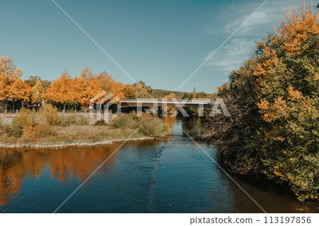 Bridge with river in Bietigheim-Bissingen, Germany. Autumn. viaduct over the Enz River, on a fall summer day. Bietigheim-Bissingen, Germany. Bridge in Bietigheim reflected in the river. Baden Bridge with river in Bietigheim-Bissingen, Germany. Autumn. viaduct over the Enz River, on a fall summer day. Bietigheim-Bissingen, Germany. Bridge in Bietigheim reflected in the river. Baden 113197856