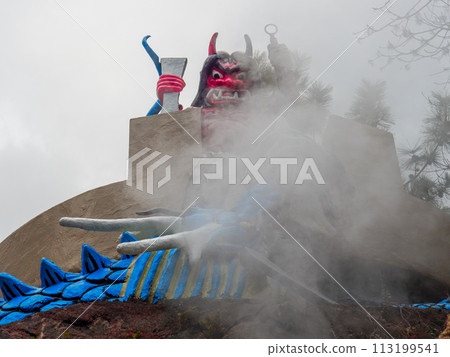 A red demon statue stands at Kamado Jigoku 2-chome, one of the Beppu Hell Tours and a sacred place for the anime Demon Slayer: Kimetsu no Yaiba. A red demon statue stands at Kamado Jigoku 2-chome, one of the Beppu Hell Tours and a sacred place for the anime Demon Slayer: Kimetsu no Yaiba. 113199541