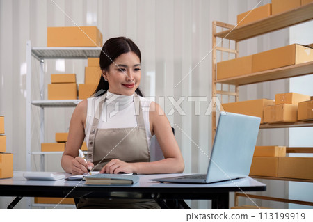 Woman asian in an online store check the customer address and package information on the laptop. Online shopping concept 113199919