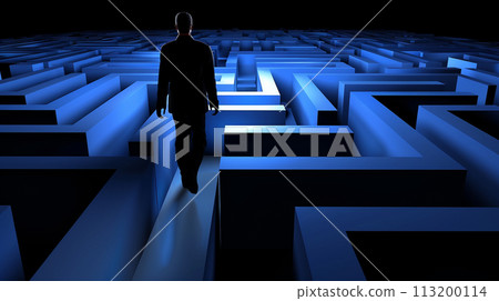 Twists and turns: A man walks through a narrow maze-like corridor 113200114