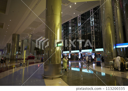 Interior of DXB Dubai International Airport terminal in Dubai, United Arab Emirates 113200335
