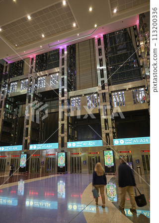 Interior of DXB Dubai International Airport terminal in Dubai, United Arab Emirates 113200336