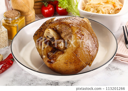 Baked pork knee with spices Baked pork knee with spices 113201266