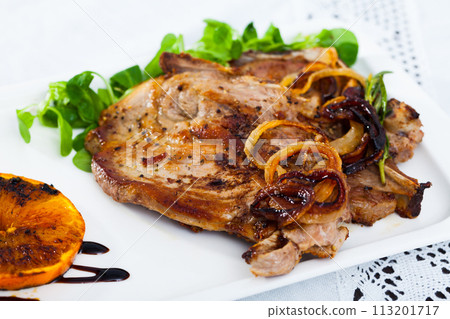Baked pork shank with grilled orange and cornsalad 113201717