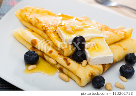 Crepes with brie and honey 113201738