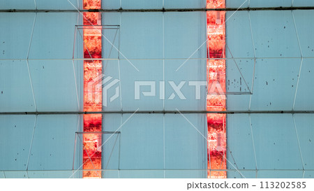 Symmetry in Sustainability: LED Lighting in a Greenhouse Facade 113202585