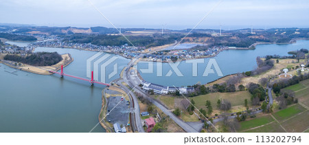 Drone | Panoramic shot | Aerial shot of the glowing red Iris Bridge over Lake Kitagata | Awara City, Fukui Prefecture Drone | Panoramic shot | Aerial shot of the glowing red Iris Bridge over Lake Kitagata | Awara City, Fukui Prefecture 113202794