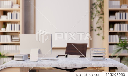 A minimalist contemporary private office features a computer on a modern marble desk. 113202960