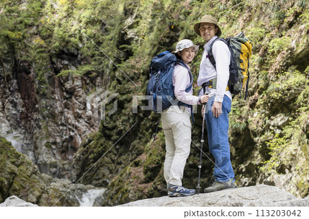 A couple enjoying hiking A couple enjoying hiking 113203042
