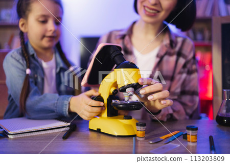 Concept of parenthood and teaching, leisure time in evening at home. 113203809