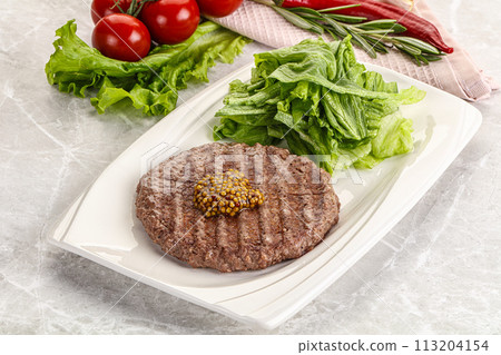 Frilled beef burger cutlet with iceberg Frilled beef burger cutlet with iceberg 113204154