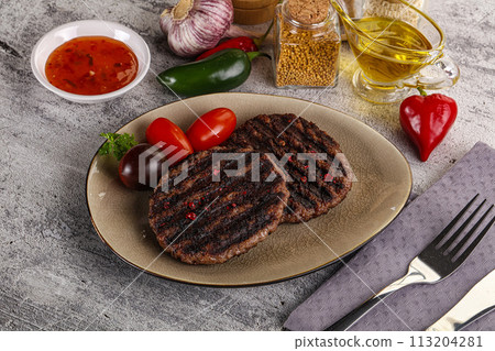 Grilled burger cutlet with sauce 113204281