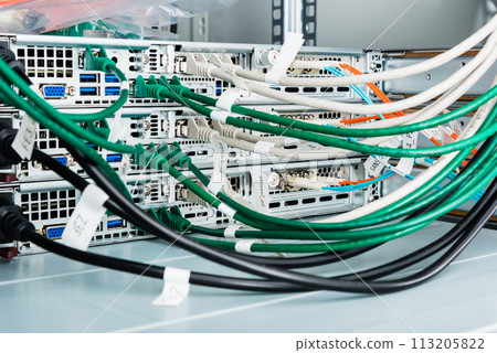 fiber optic cables connected to optic ports, network cables connected to ethernet ports fiber optic cables connected to optic ports, network cables connected to ethernet ports 113205822