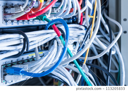 various ethernet cables plugged in network switch 113205833